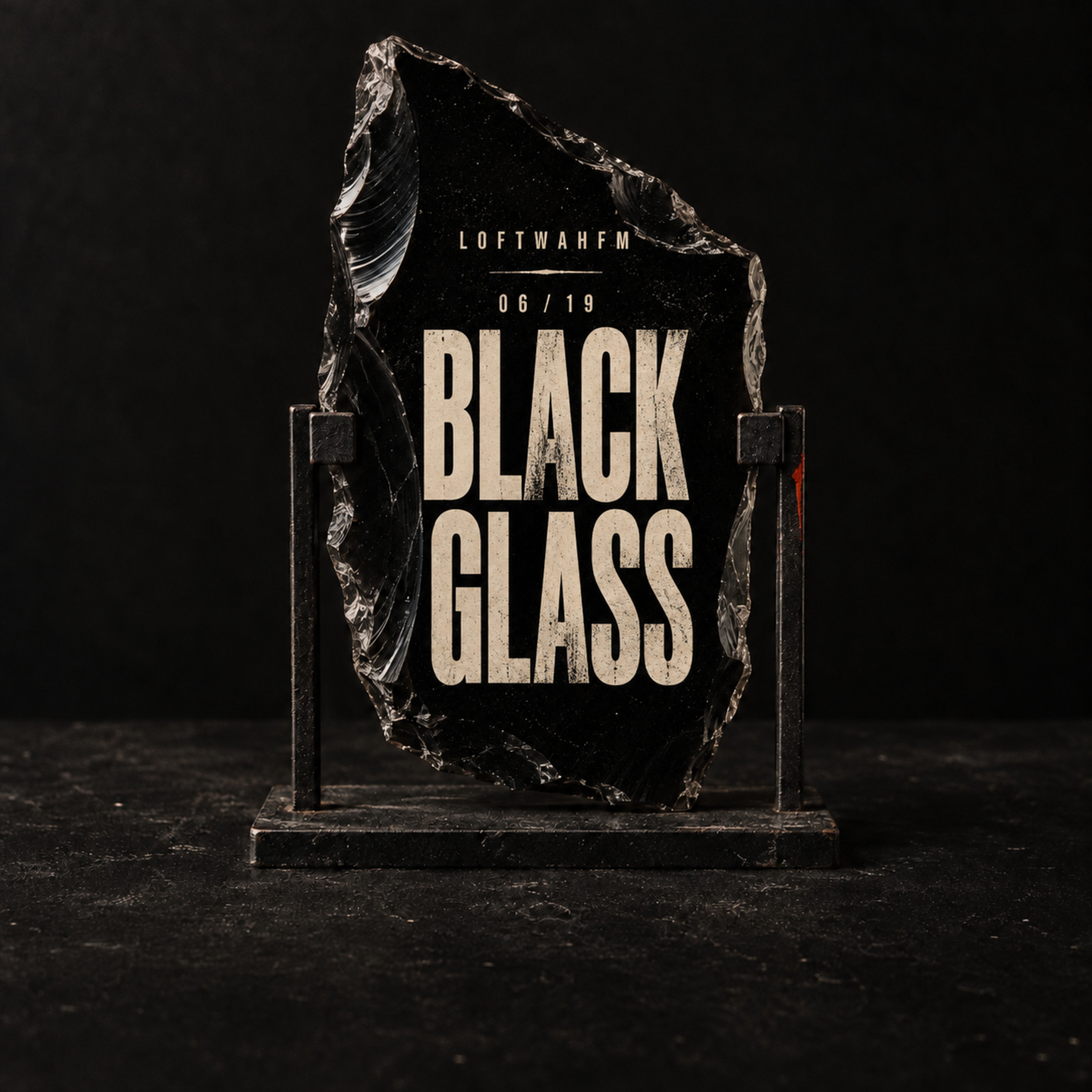 A jagged sheet of black glass returns no reflection beneath the title Black Glass.